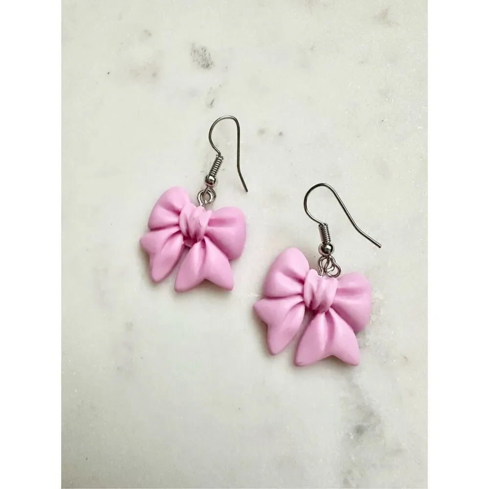 Purplish pink cute bow dangle earrings ￼